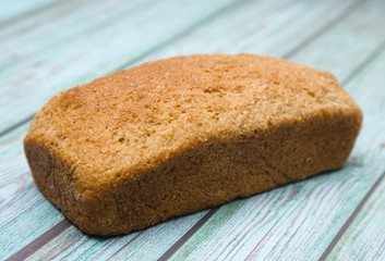 Loaf of Whole Wheat Bread on a Blue Wood Table