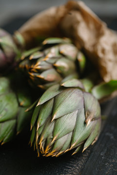 Artichokes on a wooden table