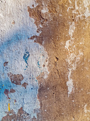 Texture of the old wall with traces of paint, grout and cement. Vertical image