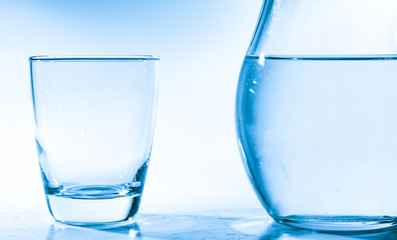 Jug and glass with drinking water