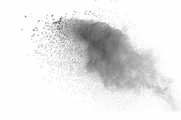 Abstract freeze motion of black dust explosion on white background. Stopping the movement of dark powder on white background. Explosive powder black on white background.