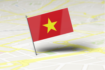 Vietnam national flag location pin stuck into a city road map. 3D Rendering
