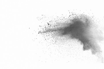 Abstract freeze motion of black dust explosion on white background. Stopping the movement of dark...