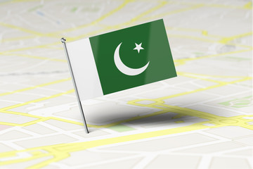 Pakistan national flag location pin stuck into a city road map. 3D Rendering