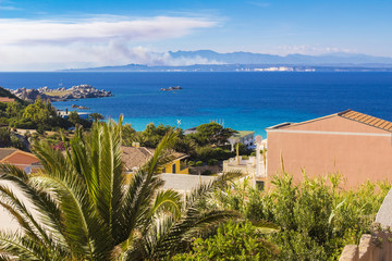 look over sea and shore in Santa Teresa Gallura town in Sardinia Italy, on the horizon Corsica island in France