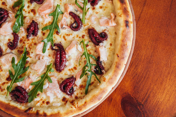 delicious pizza with meat, cheese and mushrooms