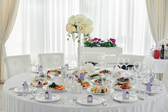 Beautiful decorated table for guests with decorations. Table setting for an event party or wedding