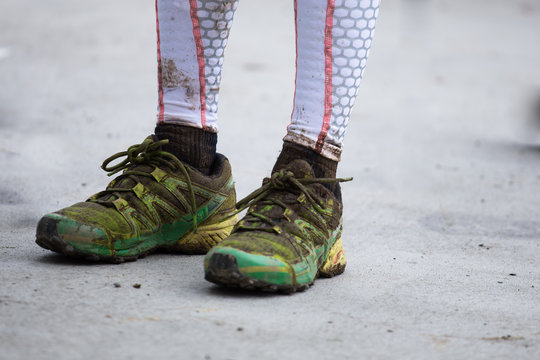 Dirty Running Shoes After Muddy Race With Compress Socks