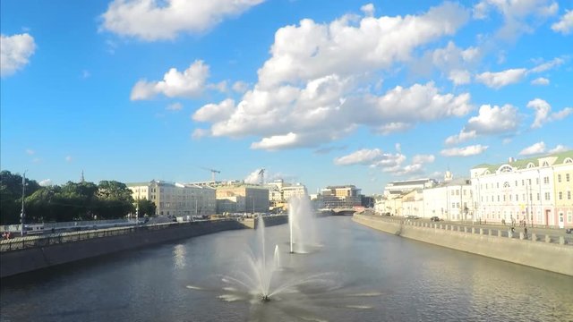 Fountains on the river in sunny summer day timelapse