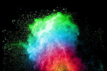 Abstract art colored powder on black background. Frozen abstract movement of dust explosion multiple colors on black background. Stop the movement of multicolored powder on dark background. - 165845751