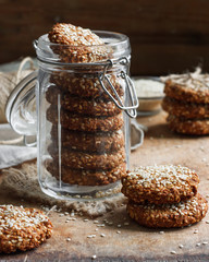 homemade cookies with sesame seeds in a glass jar