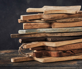 Stack of wooden cutting boards - obrazy, fototapety, plakaty