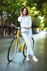 Lovely woman woman with a bicycle