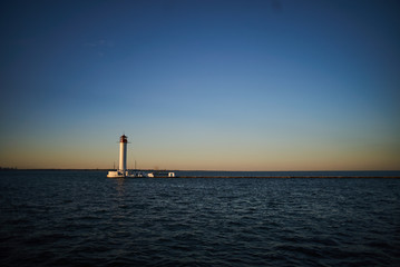lighthouse standing on sea near port in Odessa