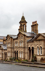 Fototapeta na wymiar Victorian buildings on Victoria Road, Saltaire, Bradford