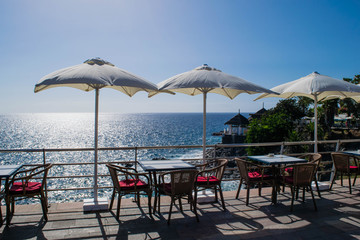 Table and chairs with umbrella and a beautiful sea view, Tenerife, Costa Adeje, canary islands, Spain