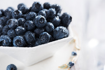 Fresh blueberries in white bowl