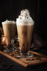 Iced coffee on wooden background