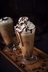 Iced coffee on wooden background