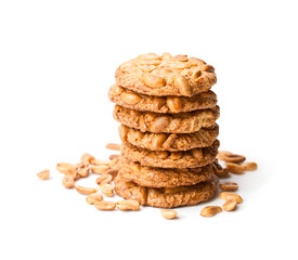 Stack  of sugar cookies with monkey nuts isolated on white