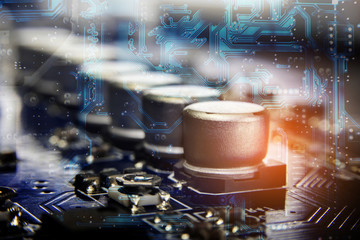 Close up macro of aluminum electrolytic capacitors installed on the motherboard and electronic...