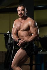Fototapeta na wymiar Bodybuilder Flexing Muscles