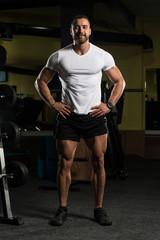 Fototapeta na wymiar Portrait Of A Muscular Man In White T-shirt