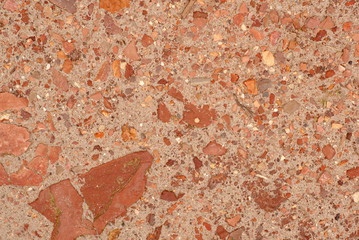 Red stones in the sand background