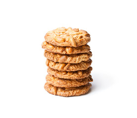 Stack  of sugar cookies with monkey nuts isolated on white