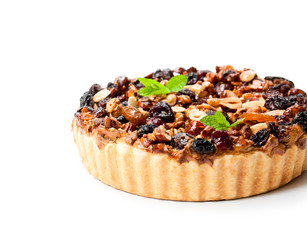 Delicious  tart with dried berries and nuts isolated on white