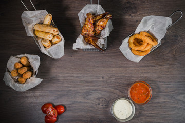 Snack for beer in the form of nuggets cheese rings and fried chicken legs