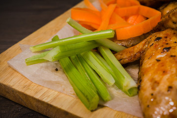 Fried chicken wings with sauce and salad