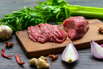 Raw beef meat on a cutting board