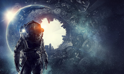 Obraz na płótnie Canvas Astronaut in fantasy world. Mixed media