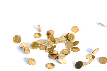 Falling gold coins. Money on a white background. shallow focus.