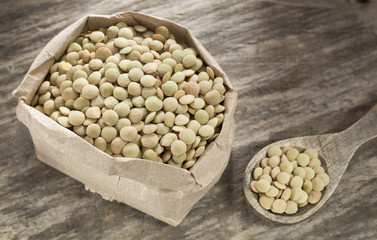 Raw lentils in the paper bag - Lens culinaris