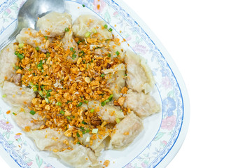 Steamed shrimp dumplings with fried sliced garlic, isolated on white background with copy space and clipping path.
