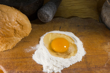 Broken egg in flour
