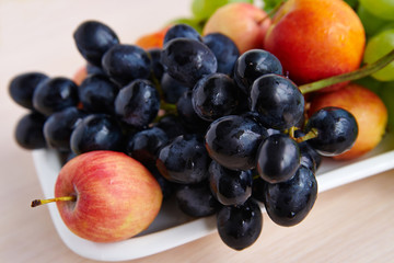 Fruit on a white plate, top view