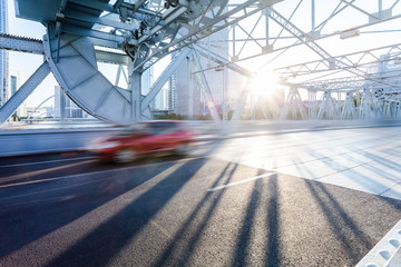 steel bridge over the haihe river against sunlight,tianjin,china.