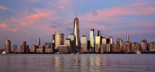 The Financial District and skyline of downtown Manhattan at sunset. 