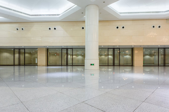 empty bright building hall with marbled floor.