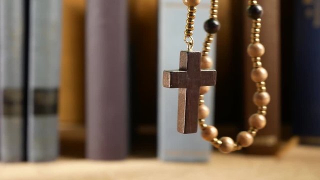 Wooden Rosary Hanging in Front of Library. No Movement Camera.