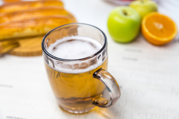 Glass with light beer and bread with fruit
