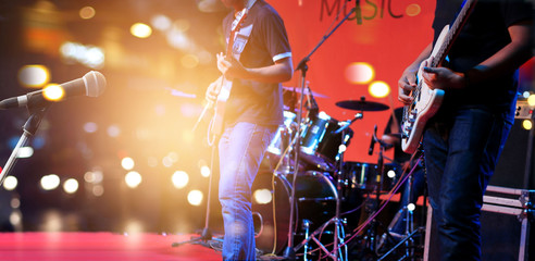Naklejka premium Guitarist on stage for background, soft and blur concept