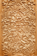 Pattern carved on wood in the temple background of thailand