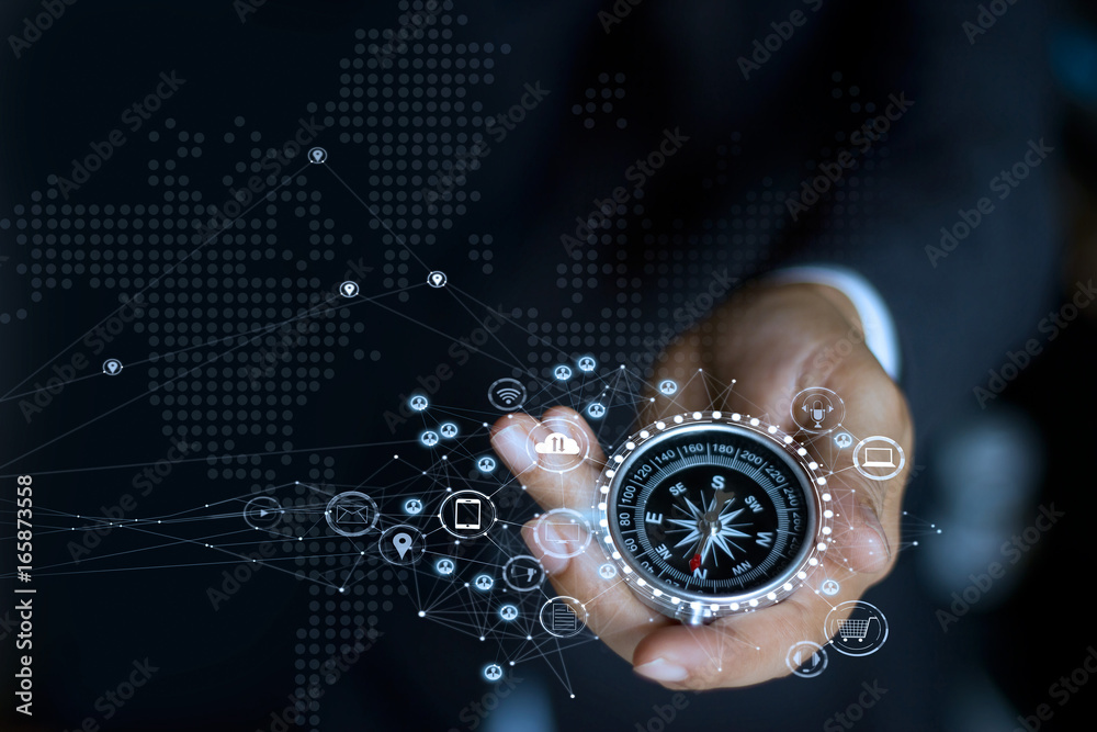 Poster businessman with a compass holding in hand. define marketing direction and search customer global ne