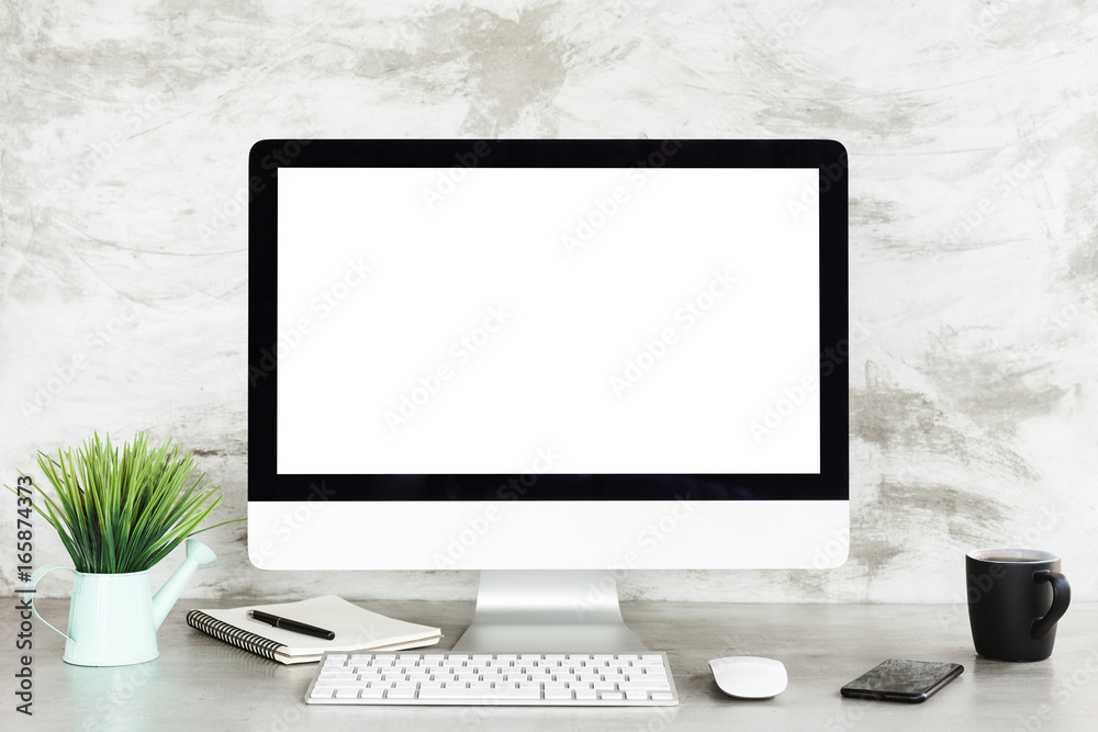 Aufkleber desktop computer on workspace table showing blank white screen