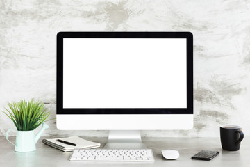 desktop computer on workspace table showing blank white screen - 165874373