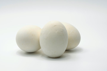 Salted egg which boiled have cracked shell put on white background